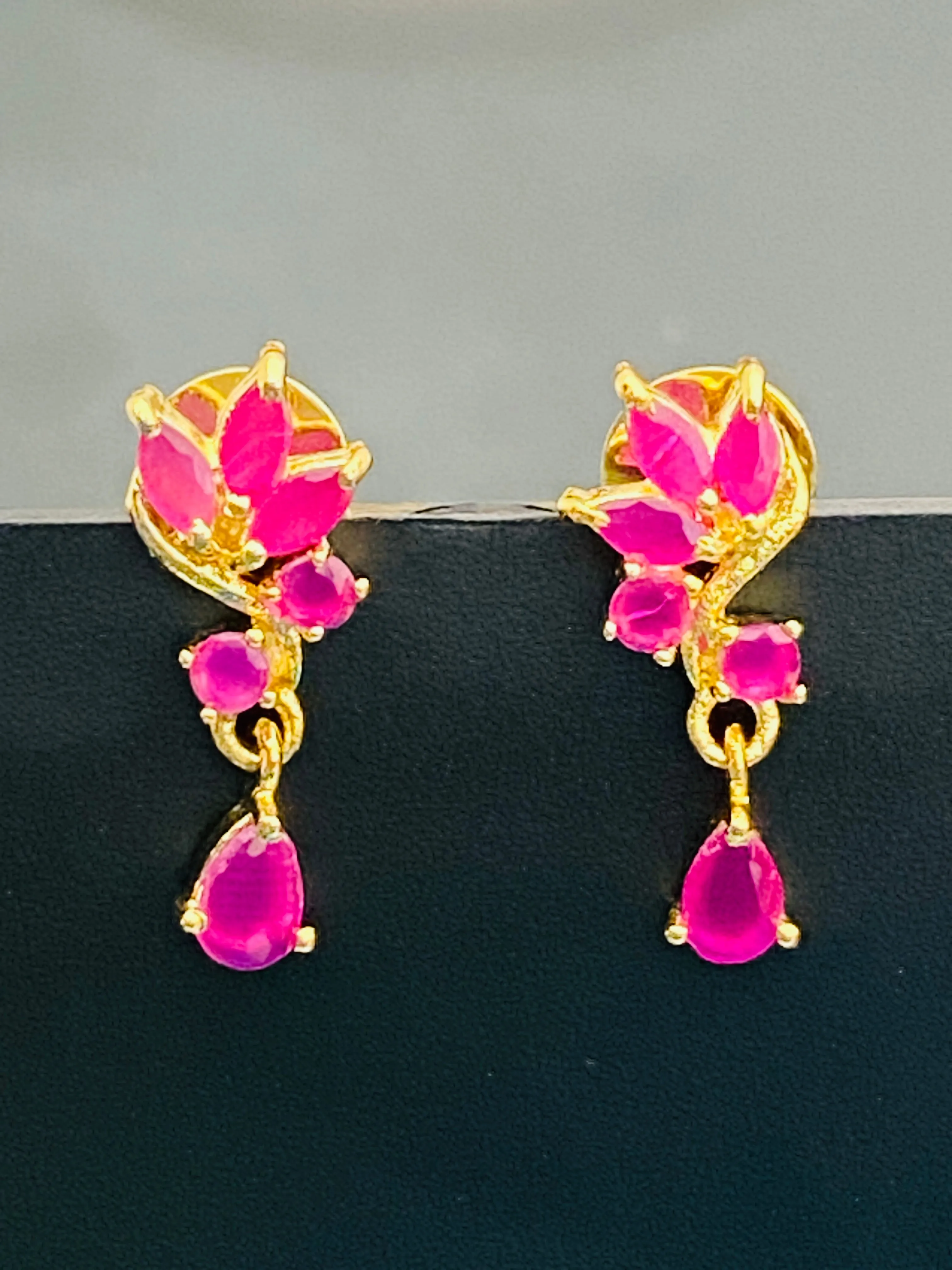 Elegant Ruby Stoned Gold Plated Earrings With Drops